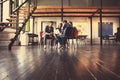 Creative business people meeting in circle of chairs. Royalty Free Stock Photo