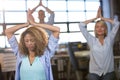 Creative business people practicing yoga Royalty Free Stock Photo