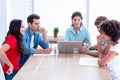 Creative business people using laptop in meeting Royalty Free Stock Photo