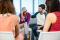 Creative business team consoling upset colleague