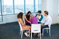 Creative business team consoling upset colleague