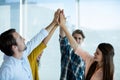 Creative business team giving a high five to each other Royalty Free Stock Photo