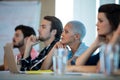 Creative business team listening at meeting in conference room Royalty Free Stock Photo