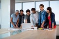 Creative business team looking at presentation in laptop Royalty Free Stock Photo