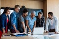 Creative business team looking at presentation in laptop Royalty Free Stock Photo