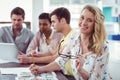 Creative business team working on a laptop together Royalty Free Stock Photo