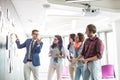 Creative businessman giving presentation to colleagues in office Royalty Free Stock Photo