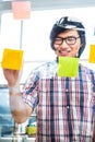Creative businessman writing on sticky notes Royalty Free Stock Photo