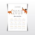 Creative calendar 2018 with cute cartoon dachshund following its