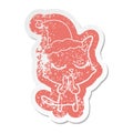 A creative calm cartoon distressed sticker of a cat wearing santa hat