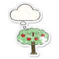 A creative cartoon apple tree and thought bubble as a distressed worn sticker Royalty Free Stock Photo
