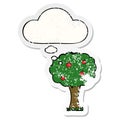 A creative cartoon apple tree and thought bubble as a distressed worn sticker Royalty Free Stock Photo