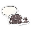 A creative cartoon baby seal and speech bubble distressed sticker