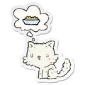 A creative cartoon cat and food and thought bubble as a distressed worn sticker Royalty Free Stock Photo