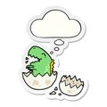 A creative cartoon dinosaur hatching and thought bubble as a printed sticker Royalty Free Stock Photo