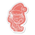 A creative cartoon distressed sticker of a pretty astronaut girl sitting waiting wearing santa hat Royalty Free Stock Photo