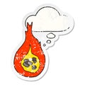 A creative cartoon fireball and thought bubble as a distressed worn sticker