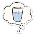A creative cartoon glass of water and thought bubble as a distressed worn sticker Royalty Free Stock Photo