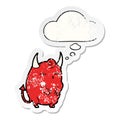 A creative cartoon halloween devil and thought bubble as a distressed worn sticker Royalty Free Stock Photo