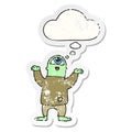 A creative cartoon halloween monster and thought bubble as a distressed worn sticker Royalty Free Stock Photo