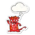 A creative cartoon halloween monster and thought bubble as a distressed worn sticker Royalty Free Stock Photo