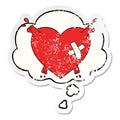 A creative cartoon heart squirting blood and thought bubble as a distressed worn sticker