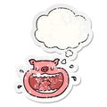 A creative cartoon obnoxious pig and thought bubble as a distressed worn sticker