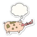 A creative cartoon oinking pig and thought bubble as a printed sticker
