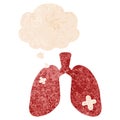 A creative cartoon repaired lungs and thought bubble in retro textured style