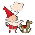 A creative cartoon santa making toy and thought bubble in grunge texture pattern style