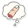 A creative cartoon severed finger and thought bubble as a printed sticker