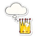 A creative cartoon simple crown and thought bubble as a distressed worn sticker