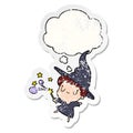 A creative cartoon witch and thought bubble as a distressed worn sticker Royalty Free Stock Photo