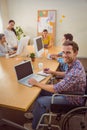 Creative casual businessman in wheelchair