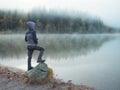 Creative child, kid photographer a little boy with a camera taking landscape pictures near la lake Royalty Free Stock Photo