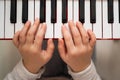 Creative child plays the synthesizer. Little girl learning to play the piano Royalty Free Stock Photo