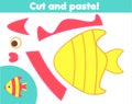 Creative children educational game. Paper cut and paste activity. Make a tropic fish with glue and scissors