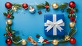 Christmas Flat Lay Composition with Blue Gift Box and Festive Decorations Frame Royalty Free Stock Photo