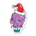 A creative christmas distressed sticker cartoon of kawaii muffin