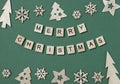 Creative Christmas flat lay composition, inscription Merry Christmas made of wooden blocks with letters and Xmas