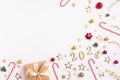 Creative Christmas and New Year composition with gift box, party streamers, confetti stars and 2024 numbers. Royalty Free Stock Photo