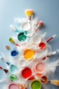 Creative christmas tree made of colorful paints and brushes on blue background Royalty Free Stock Photo