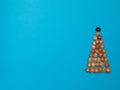 Creative Christmas tree made of seashells on modern blue paper background Royalty Free Stock Photo