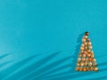 Creative Christmas tree made of seashells on modern blue paper background Royalty Free Stock Photo