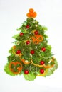 Creative christmas tree made of vegetables isolated on white Royalty Free Stock Photo