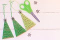 Creative Christmas trees decor on a wooden background. Cheap idea for recycled crafts and Christmas home decorating Royalty Free Stock Photo