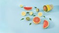 Creative cinema concept of spilled tropical fresh fruit from popcorn bucket. Summer organic food on pastel blue background