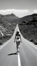 Black and white photo of amazing winding long road desert landscape view with beautiful back view of model lady. generative ai