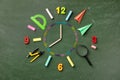 Creative clock face from colorful school supplies on blackboard top view and flat lay. Back to school and time to study concept Royalty Free Stock Photo