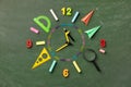 Creative clock face from colorful school supplies on blackboard top view and flat lay. Back to school and time to study concept Royalty Free Stock Photo